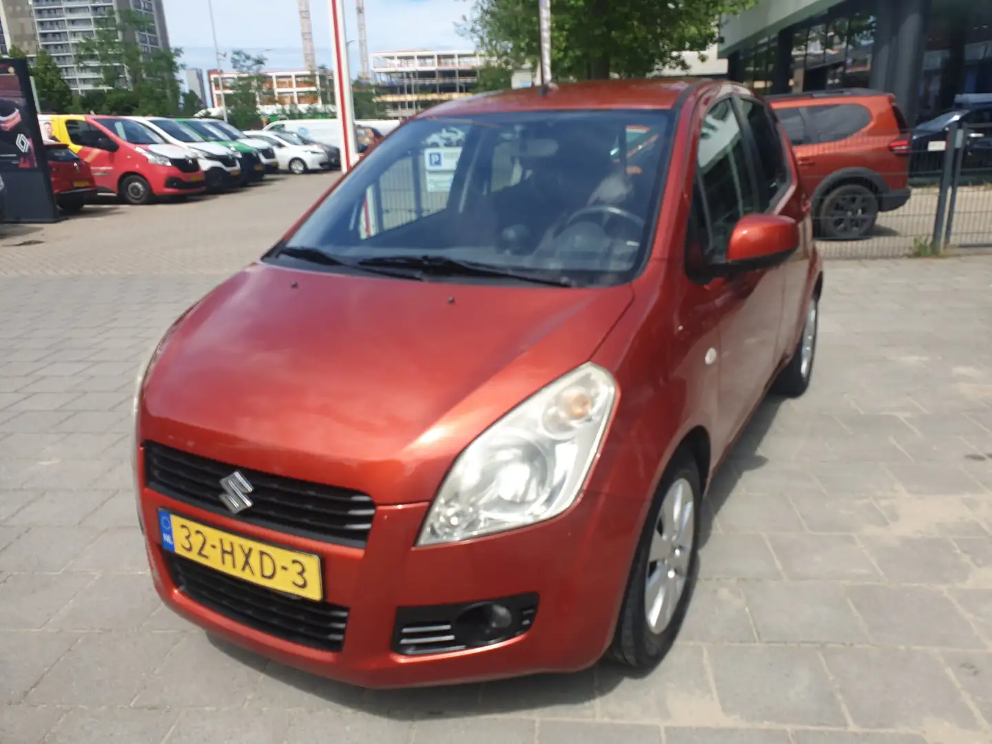 Suzuki Splash 1.0 Exclusive . Oranje - 1