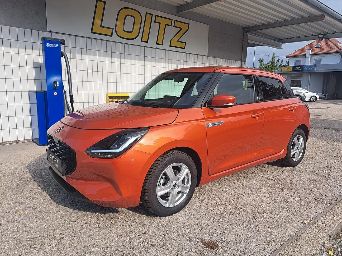 Suzuki Swift 1,2 Hybrid Flash Orange - 1