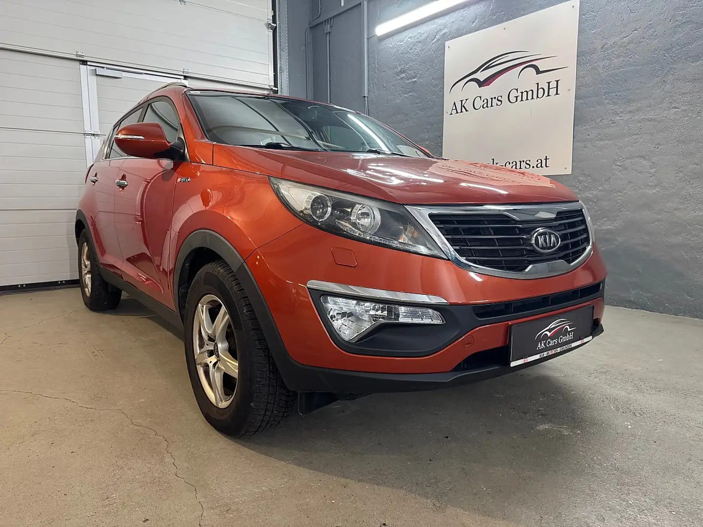 Kia Sportage SLS 2,0 CRDi 4WD Aut.*Kamera*Anhänger*Sitzheizu... Orange - 1