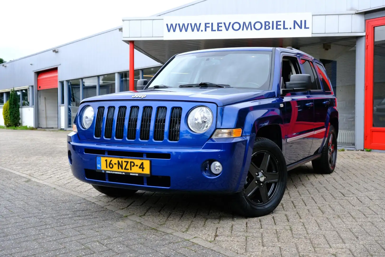 Jeep Patriot 2.4 AWD Limited Liberty Aut. Leder|Clima|LMV Blauw - 1