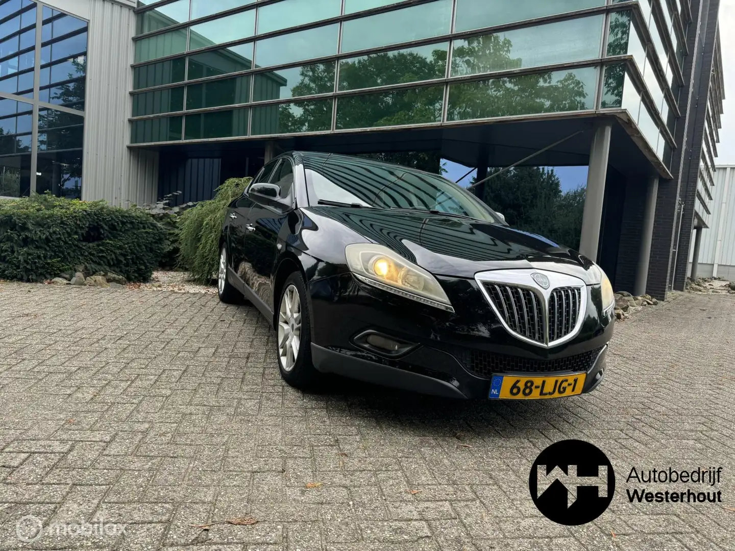 Lancia Delta 1.4-16V Oro Dealer onderhouden Navigatie NWE APK Zwart - 1