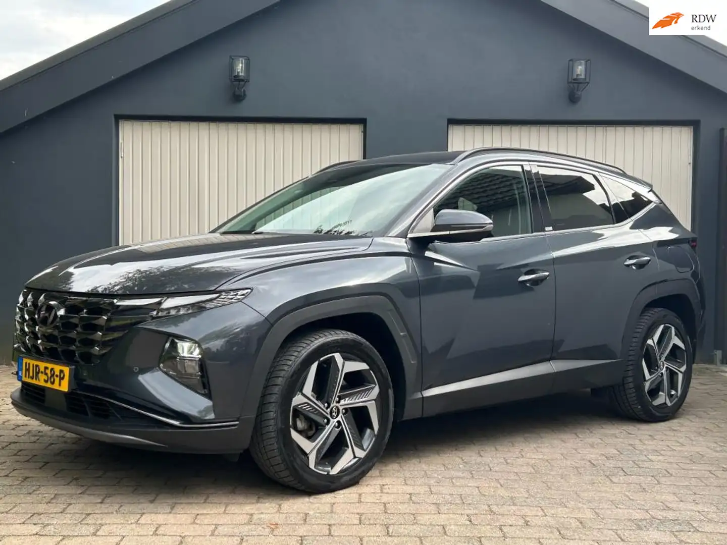 Hyundai TUCSON 1.6 T-GDI PHEV Comfort 4WD / Stuur + stoelverwarmi Grijs - 1
