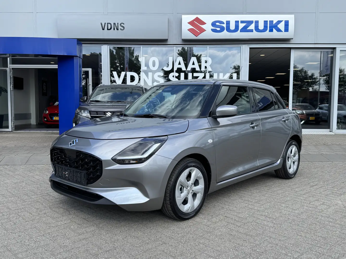 Suzuki Swift 1.2 Select Smart Hybrid Per direct beschikbaar uit Zilver - 1