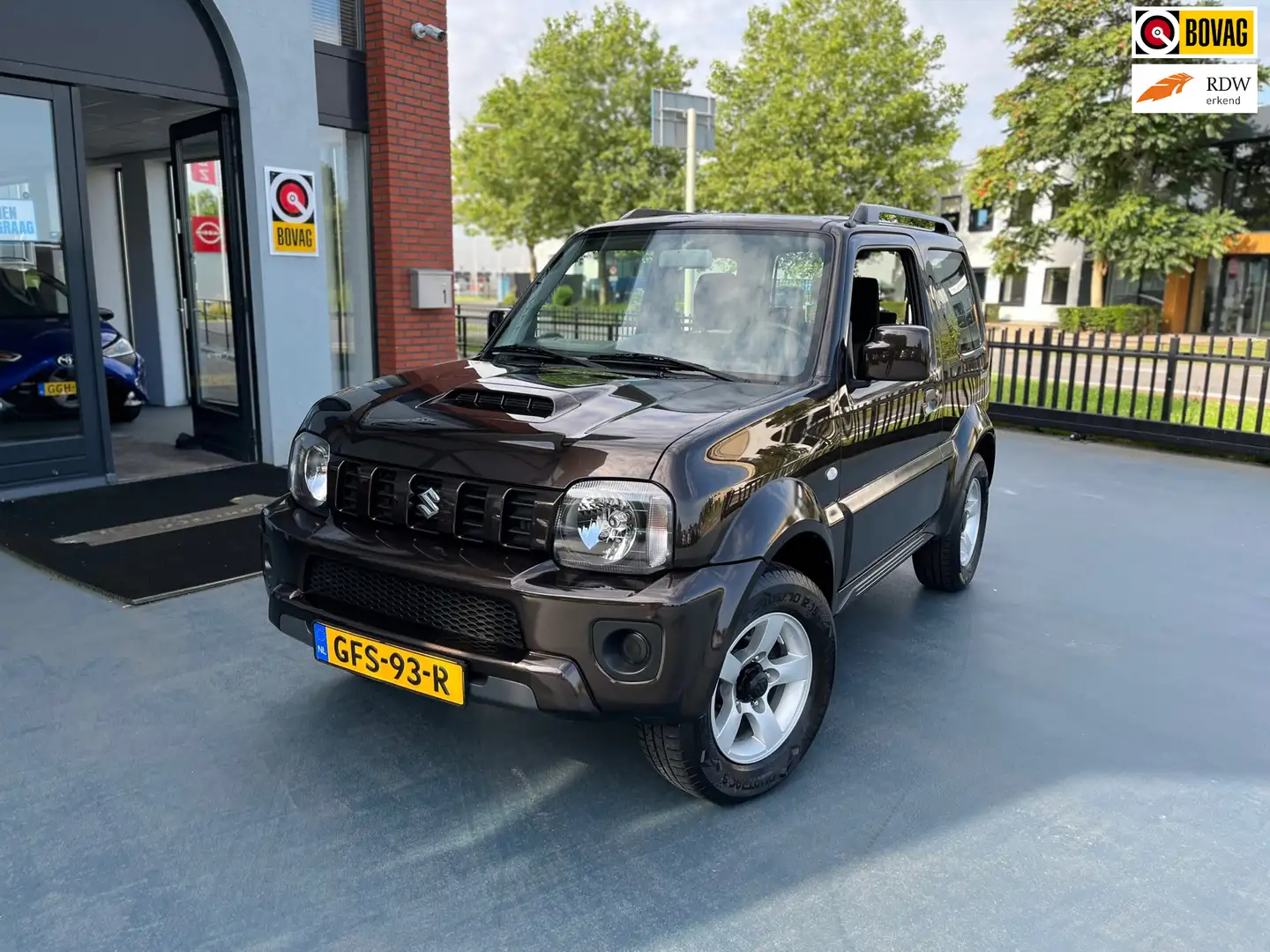 Suzuki Jimny 1.3 Exclusive 4x4 AUTOMAAT AIRCO LMV Bruin - 1