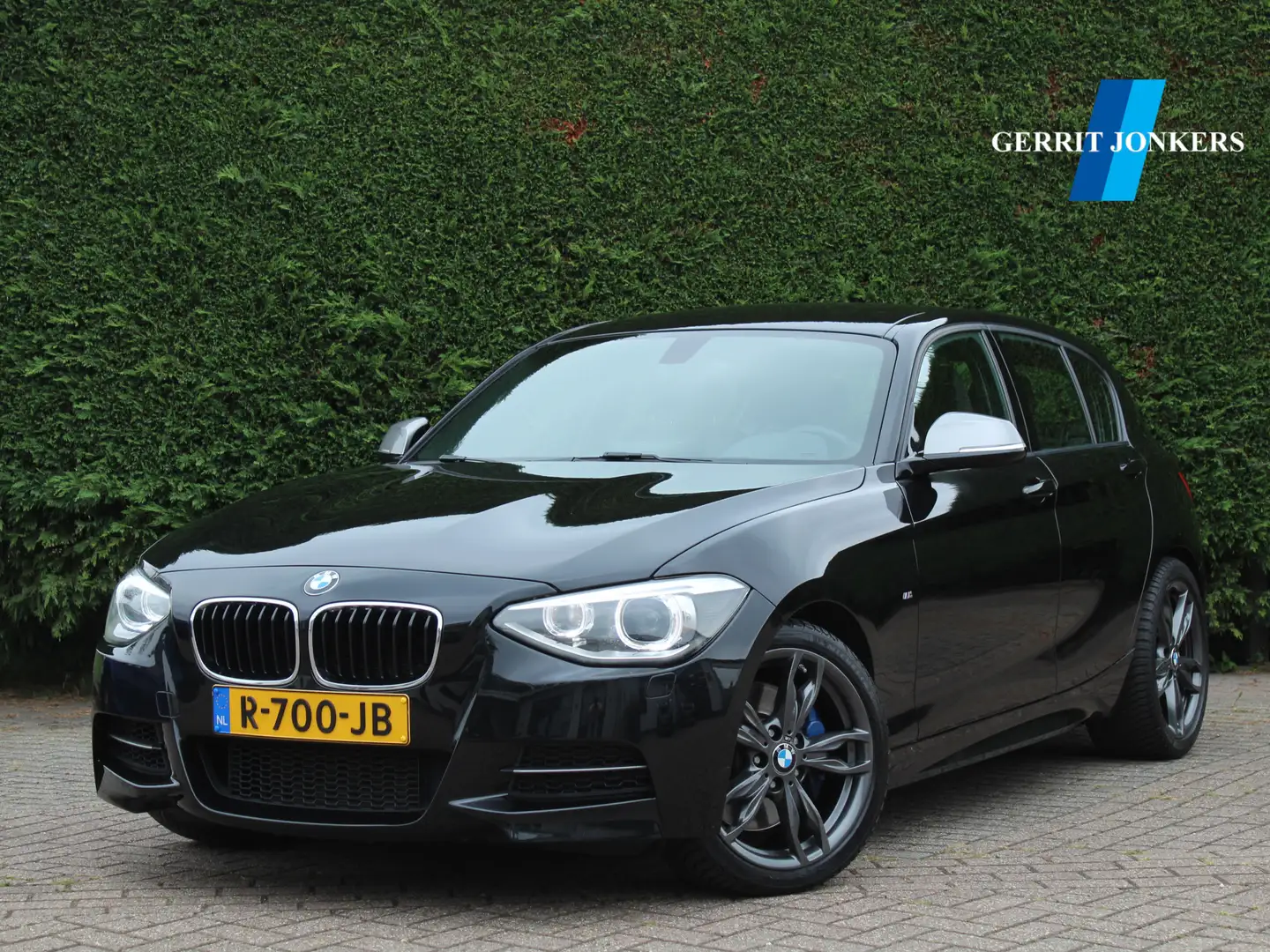 BMW 135 1-serie M135i xDrive High Executive Schwarz - 1
