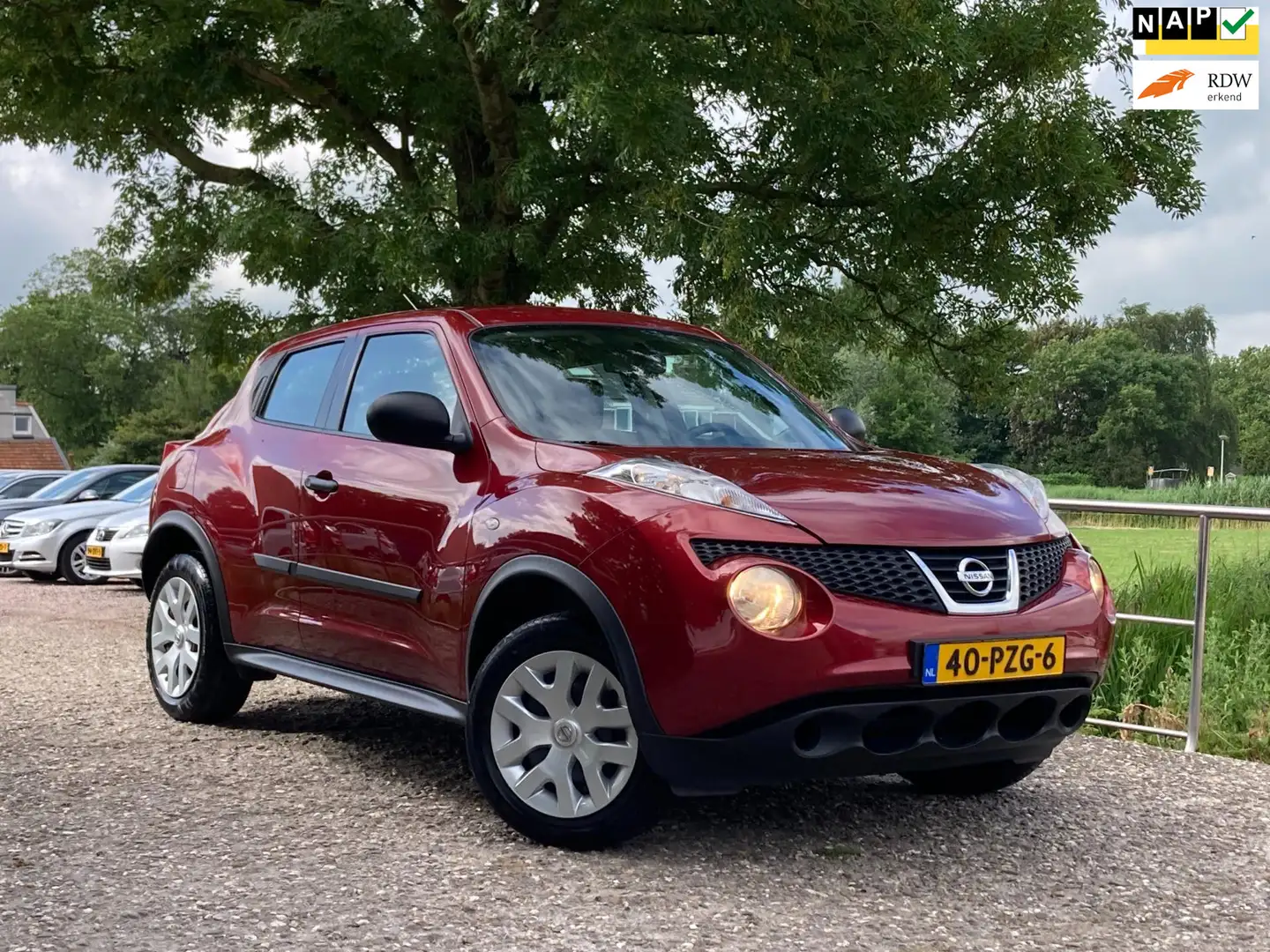 Nissan Juke 1.6 Visia Eco | NAP + Airco nu €6.975,-!! Rood - 1