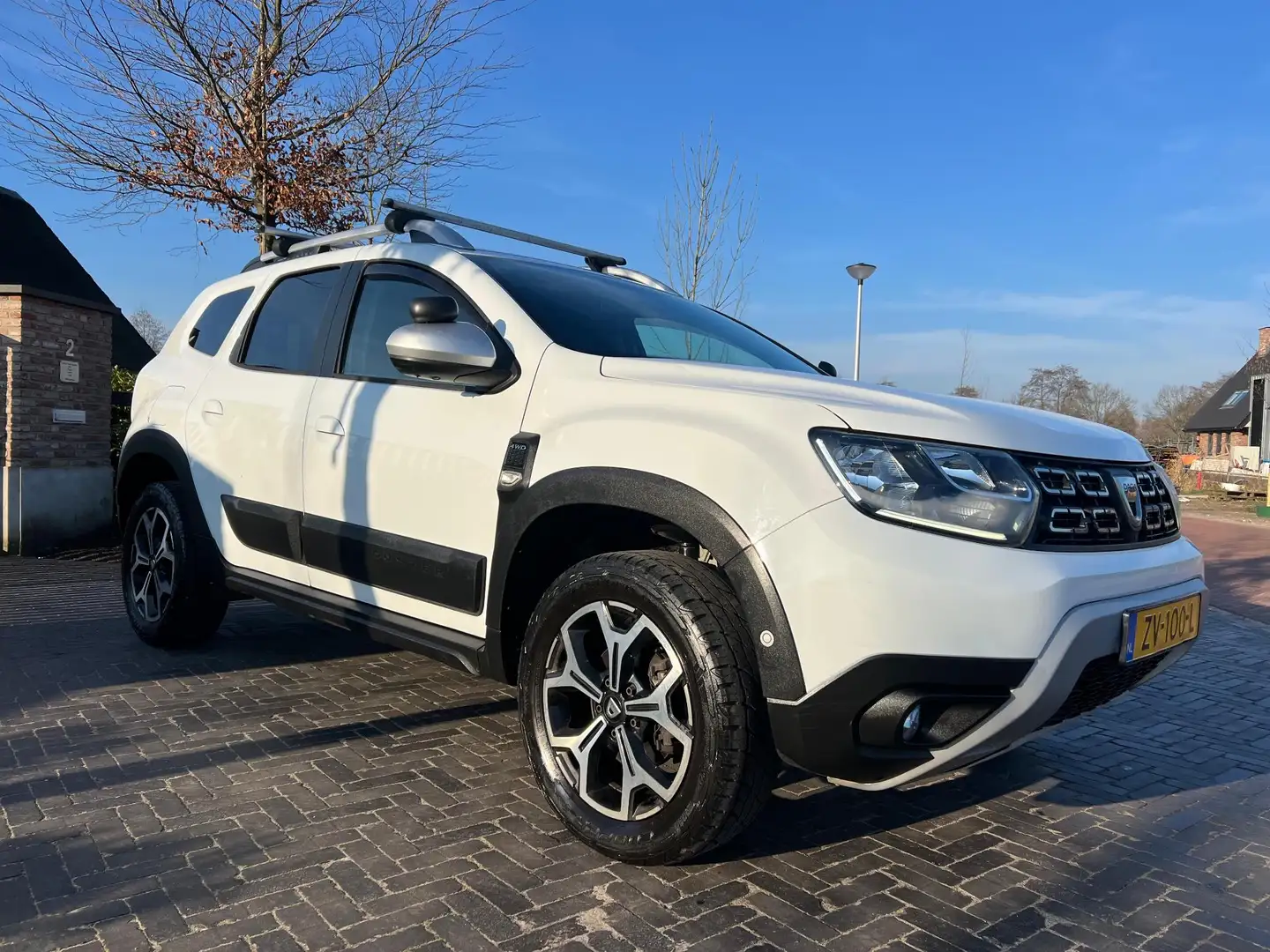 Dacia Duster 1.6 SCe Prestige | Unieke bedrijfswagen | 4X4 | Ca Wit - 2
