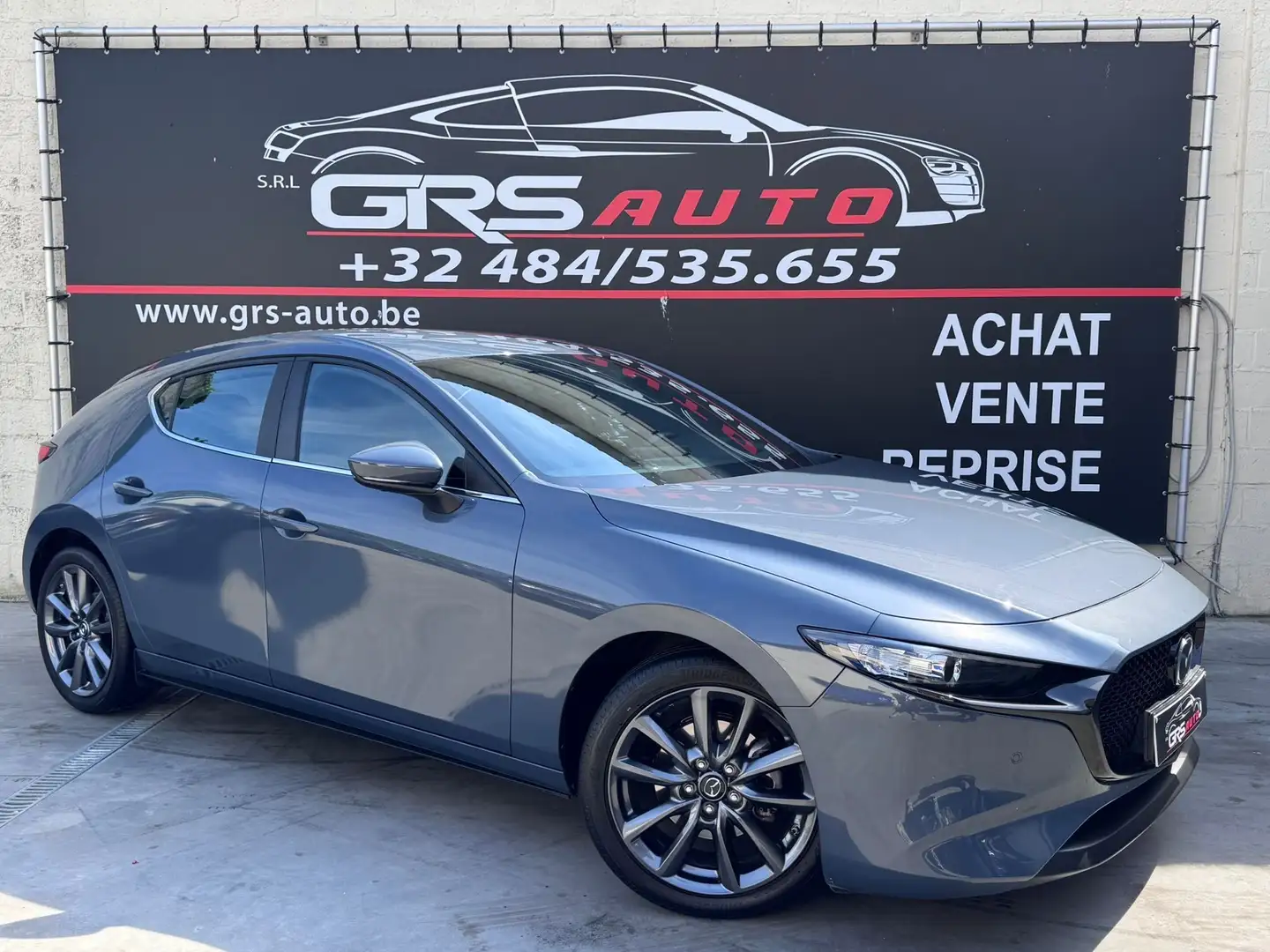 Mazda 3 Hatchback 2.0i e-Skyactiv-G Skydrive 1ER PROP. Grau - 1