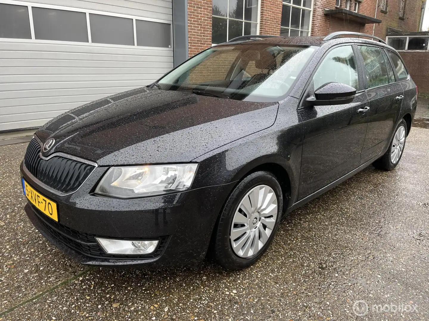 Skoda Octavia Combi 1.2 TSI Greentech Ambition Zwart - 1