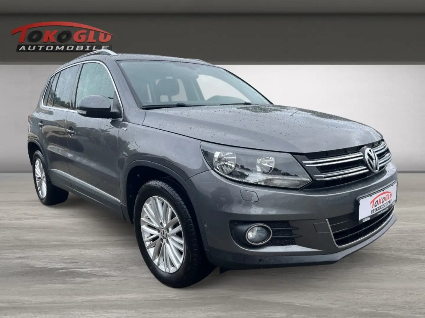 Volkswagen Tiguan Sport & Style BMT 1.4 AHK-klappbar Navi Mehrzonen Beige - 1