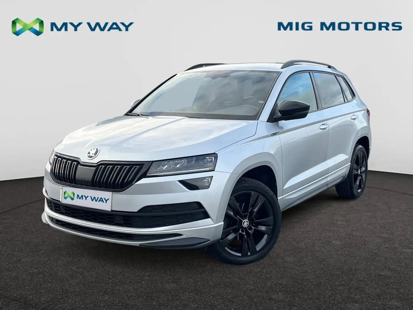 Skoda Karoq Sportline 1,5 TSI (150pk) AUTOMAAT /// wegklapbare rekhaak /// Achteruitrijcamera /// Elektrische Koffer /// Zetelverwarm Argent - 1