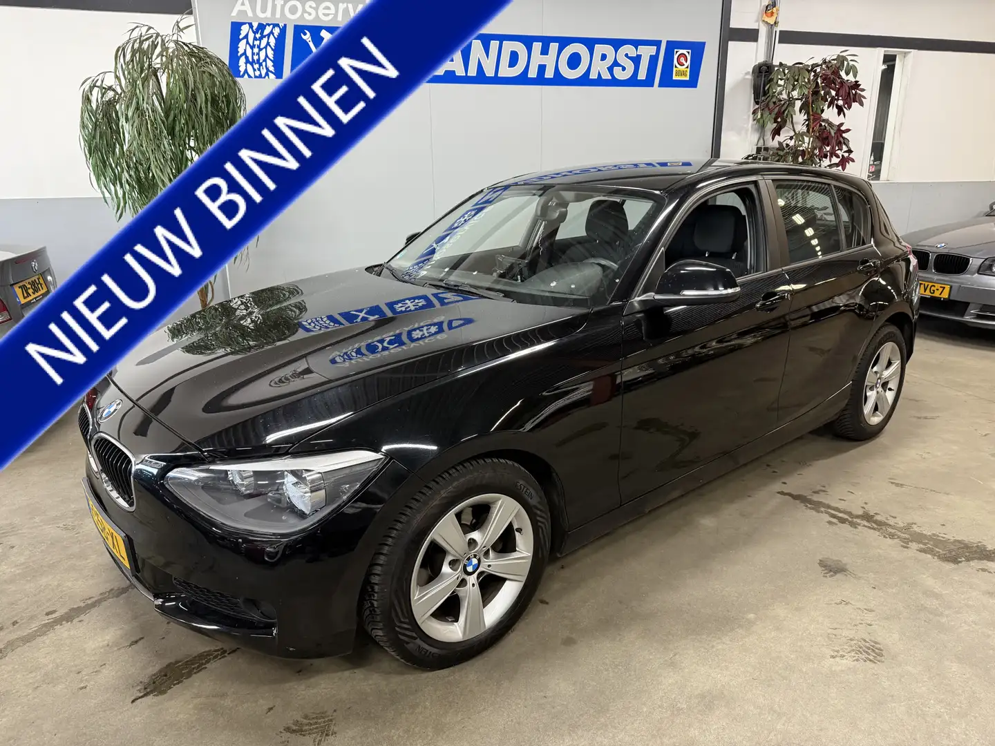 BMW 114 1-serie 114i EDE Executive Zwart - 1
