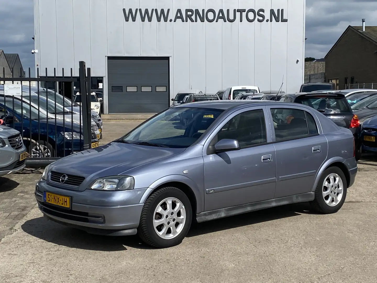 Opel Astra 1.6 8V Edition 5-DEURS, APK TOT 07-07-26, AIRCO, C Grijs - 1