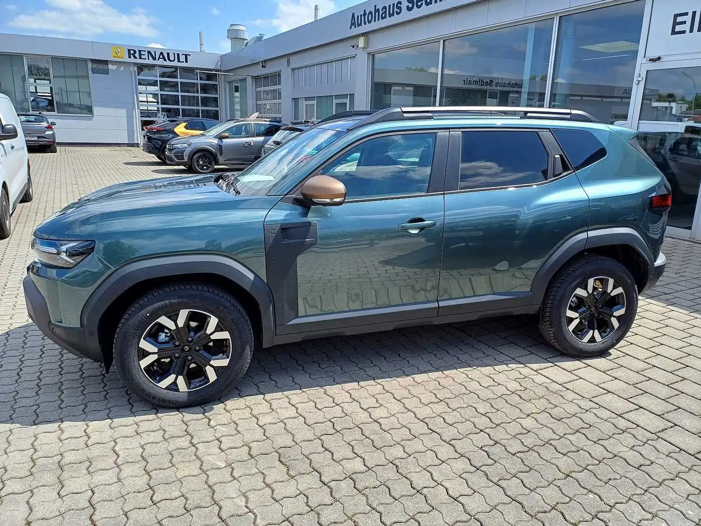 Dacia Duster 1.2 TCe 130 Mild-Hybrid Extreme 4x4/City Paket+Tec Grün - 1