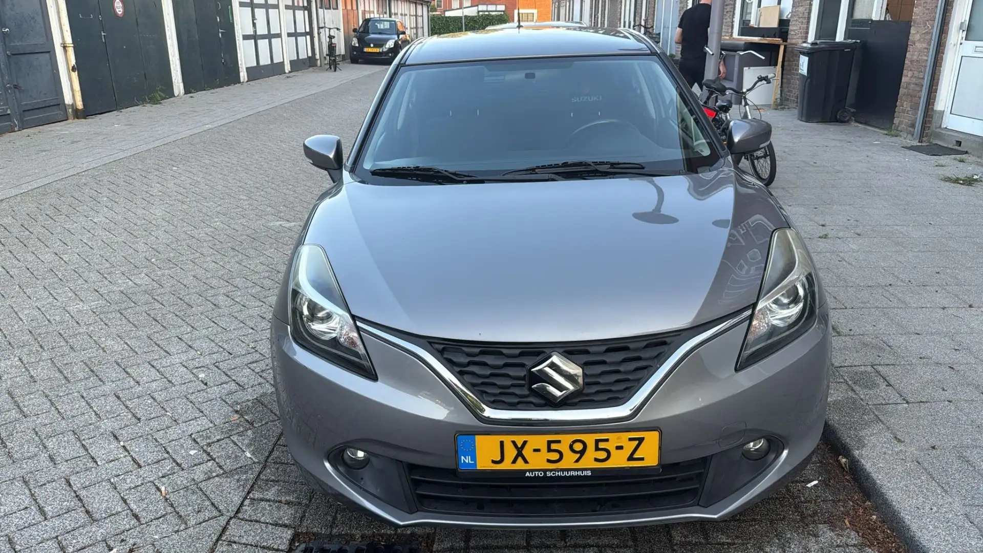 Suzuki Baleno 1.2 SH High Exec. Grijs - 1