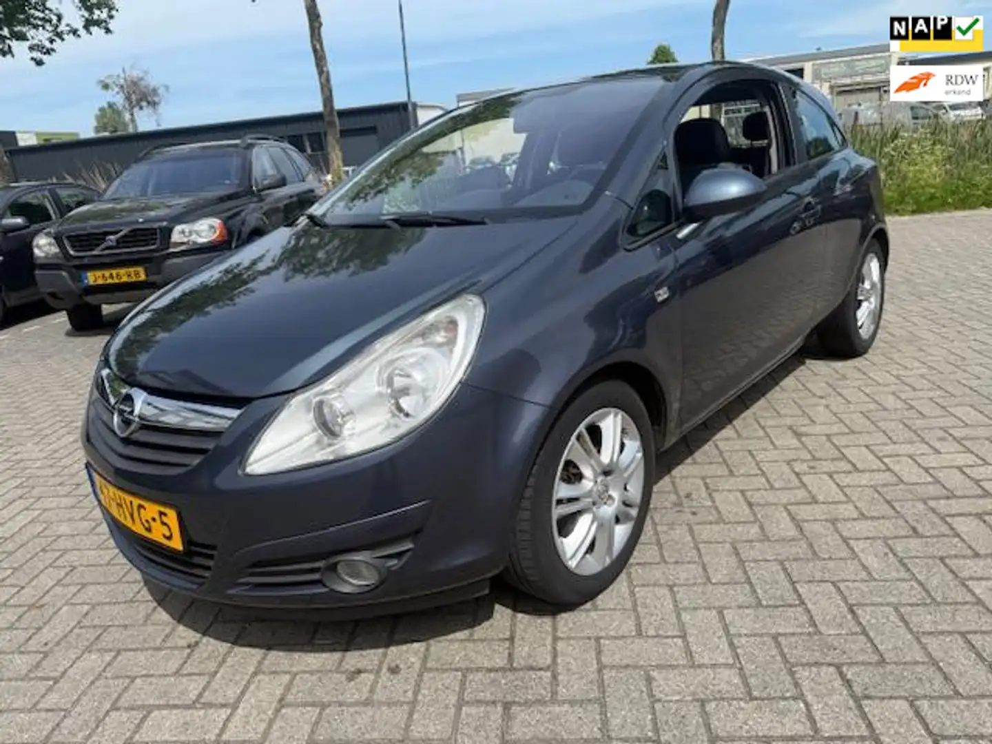 Opel Corsa 1.4-16V Cosmo Airco Stoel/stuurverwarming Parksens Grijs - 1