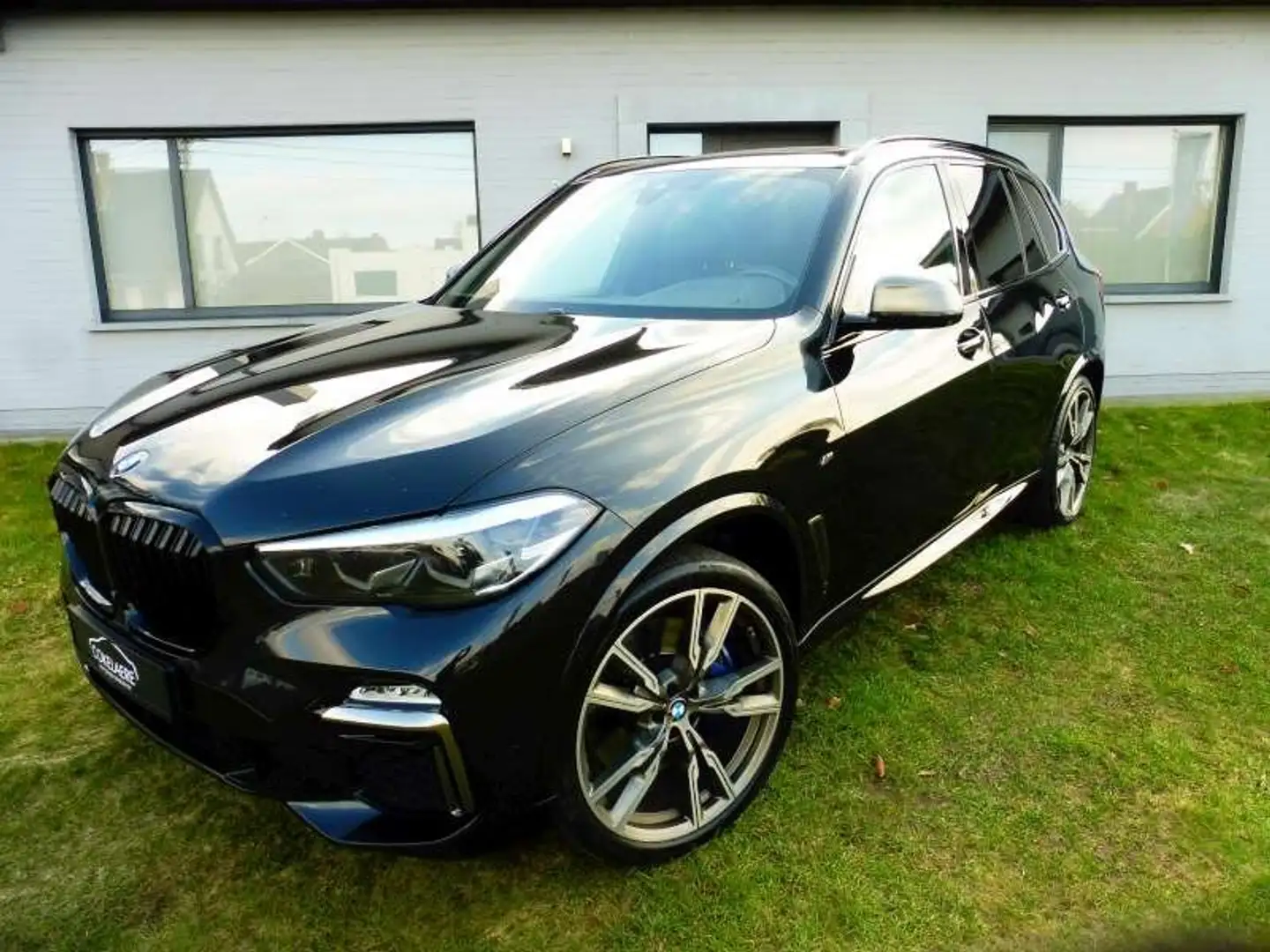 BMW X5 M50 dAS PanoDak/MemorySeats/Camera/1steHand/22" Zwart - 1