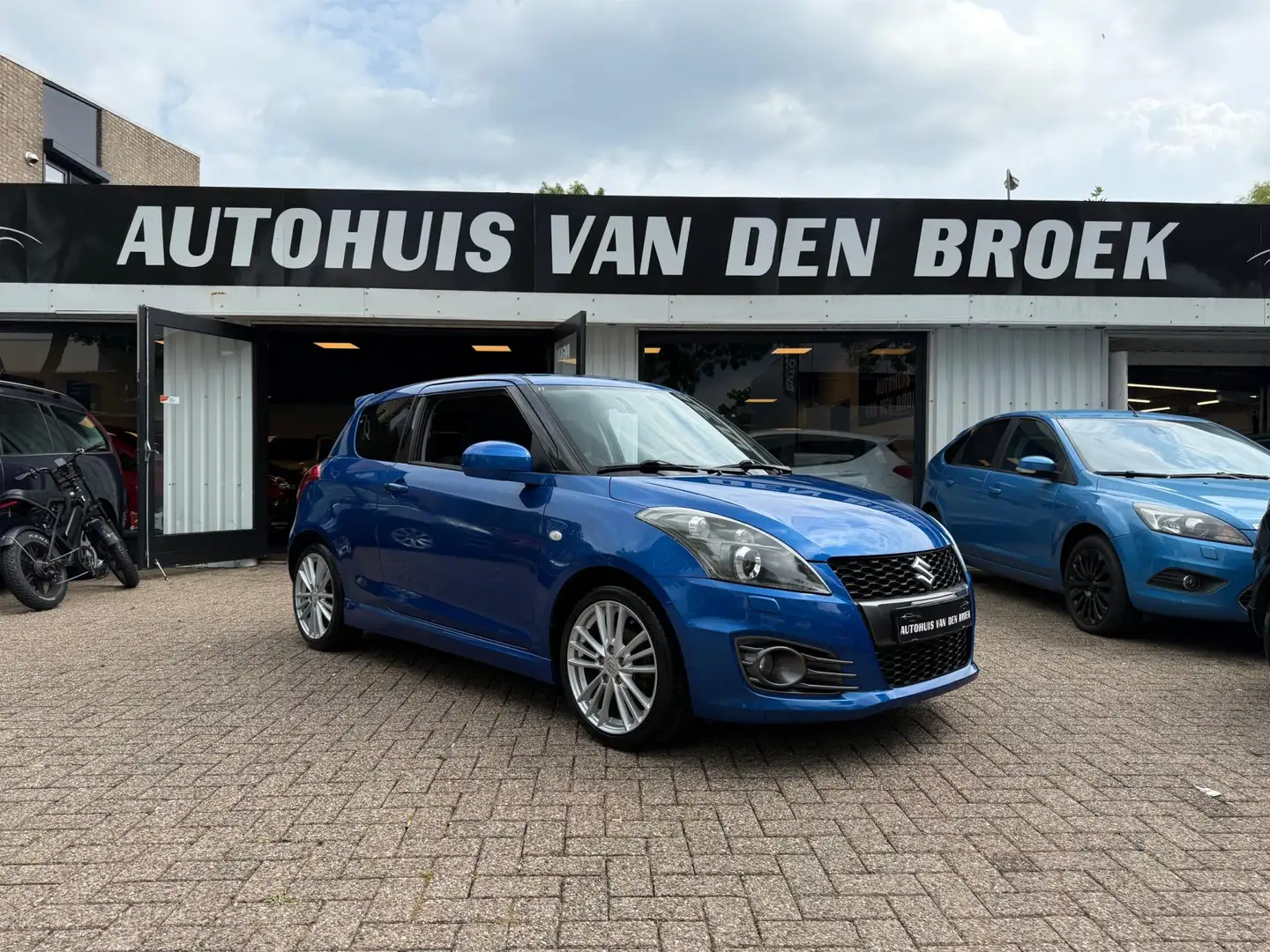 Suzuki Swift 1.6 Sport 136Pk|Xenon|Cruise|Clima|Stoelverw|Keyle Blauw - 1