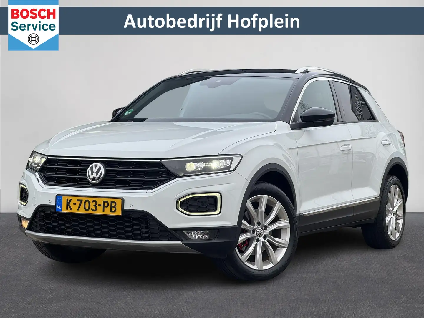 Volkswagen T-Roc 1.5 TSI Sport | Airco | Carplay | Camera | Parkeer Weiß - 1