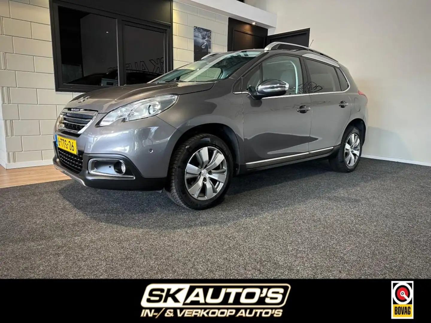 Peugeot 2008 1.2 VTI ALL. PACK PR RIJKAAR l PANO l NAVI l PDC l Grijs - 1