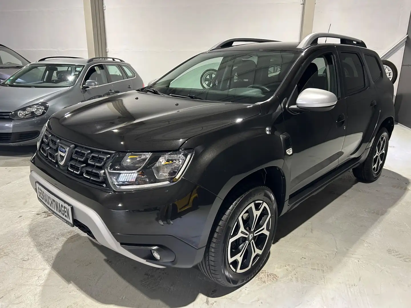 Dacia Duster II 1.6 SCe Prestige 2WD*Navi*Klimaaut.* Schwarz - 1
