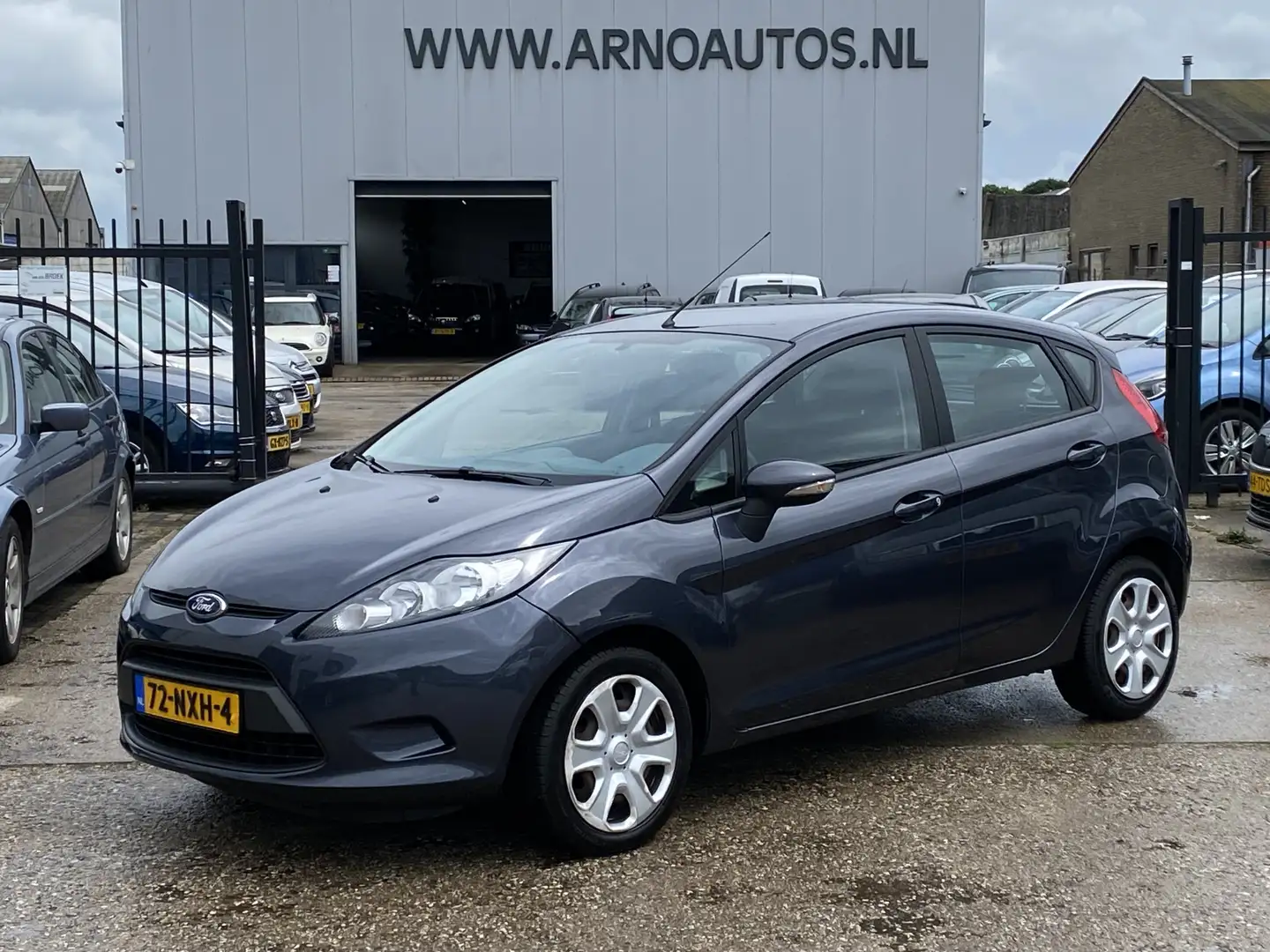 Ford Fiesta 1.25 Limited 5-DEURS, 154.522 KM NAP, 1E EIGENAAR, Grijs - 1