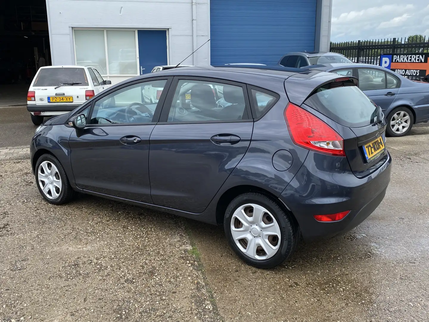Ford Fiesta 1.25 Limited 5-DEURS, 154.522 KM NAP, 1E EIGENAAR, Grijs - 2