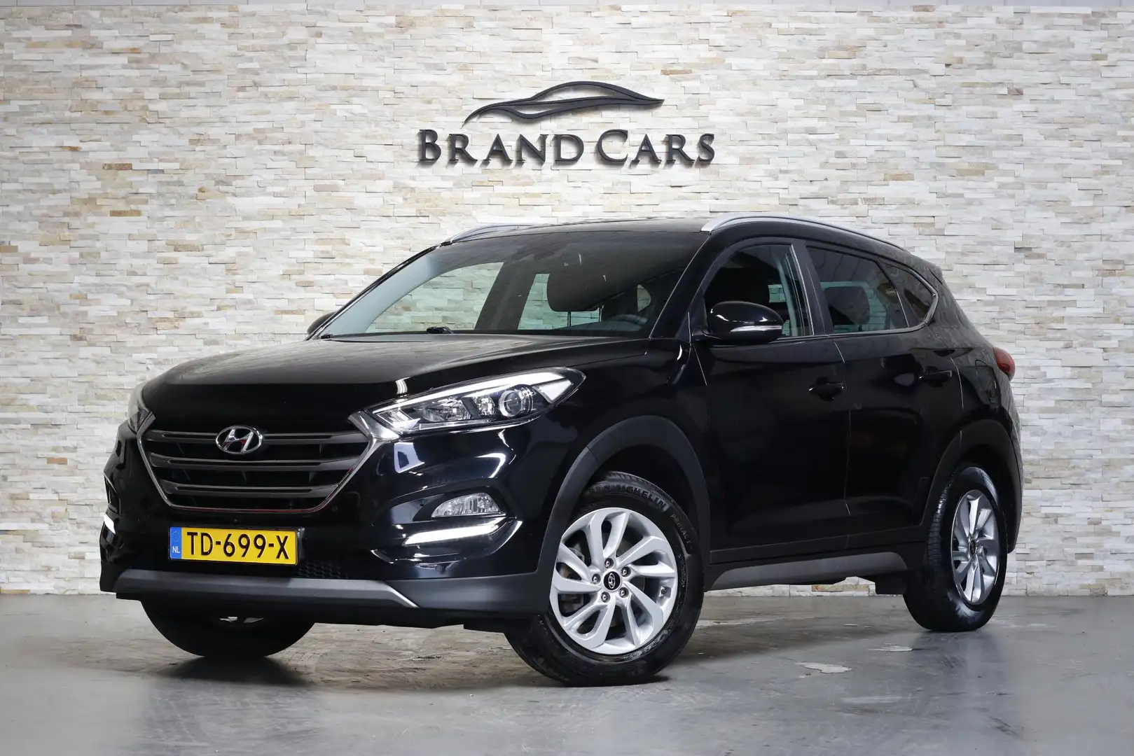 Hyundai TUCSON 1.6 GDi Comfort | Dealer OH | NAP | NAVI | Zwart - 1