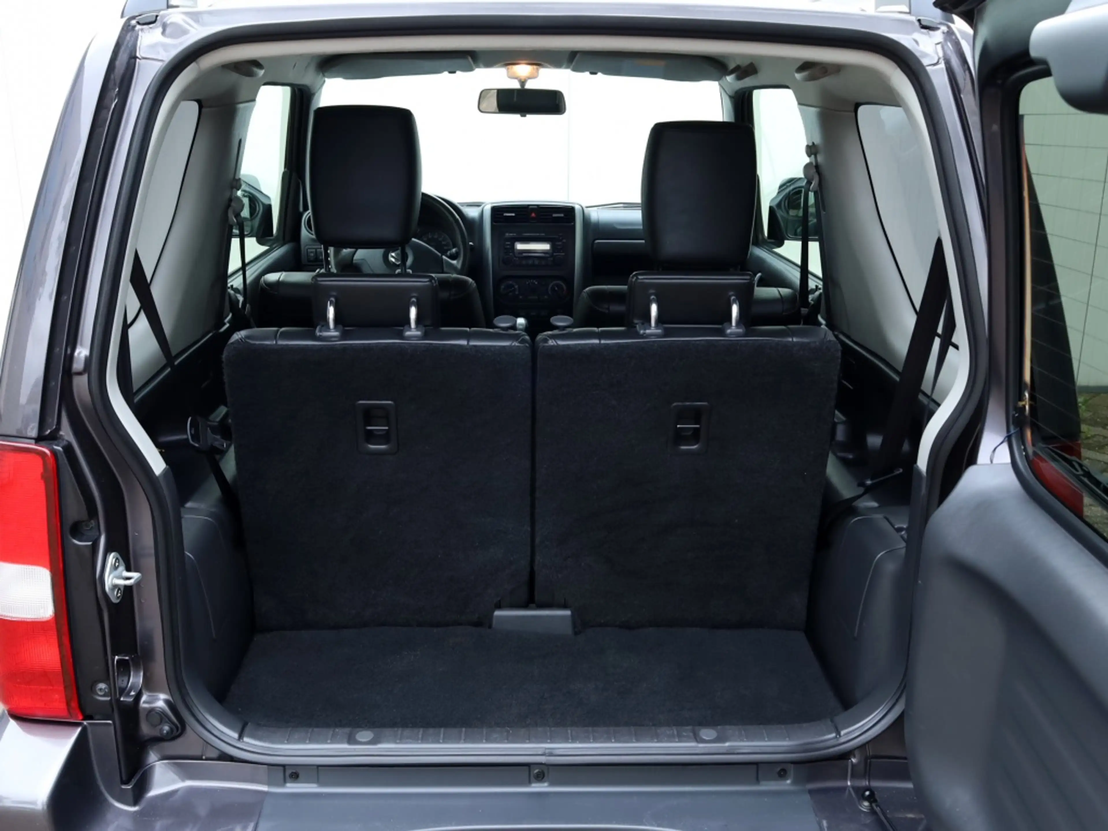 Suzuki Jimny 1.3 Exclusive 4x4 AUTOMAAT | Leder | Airco | Trekh — photo 31