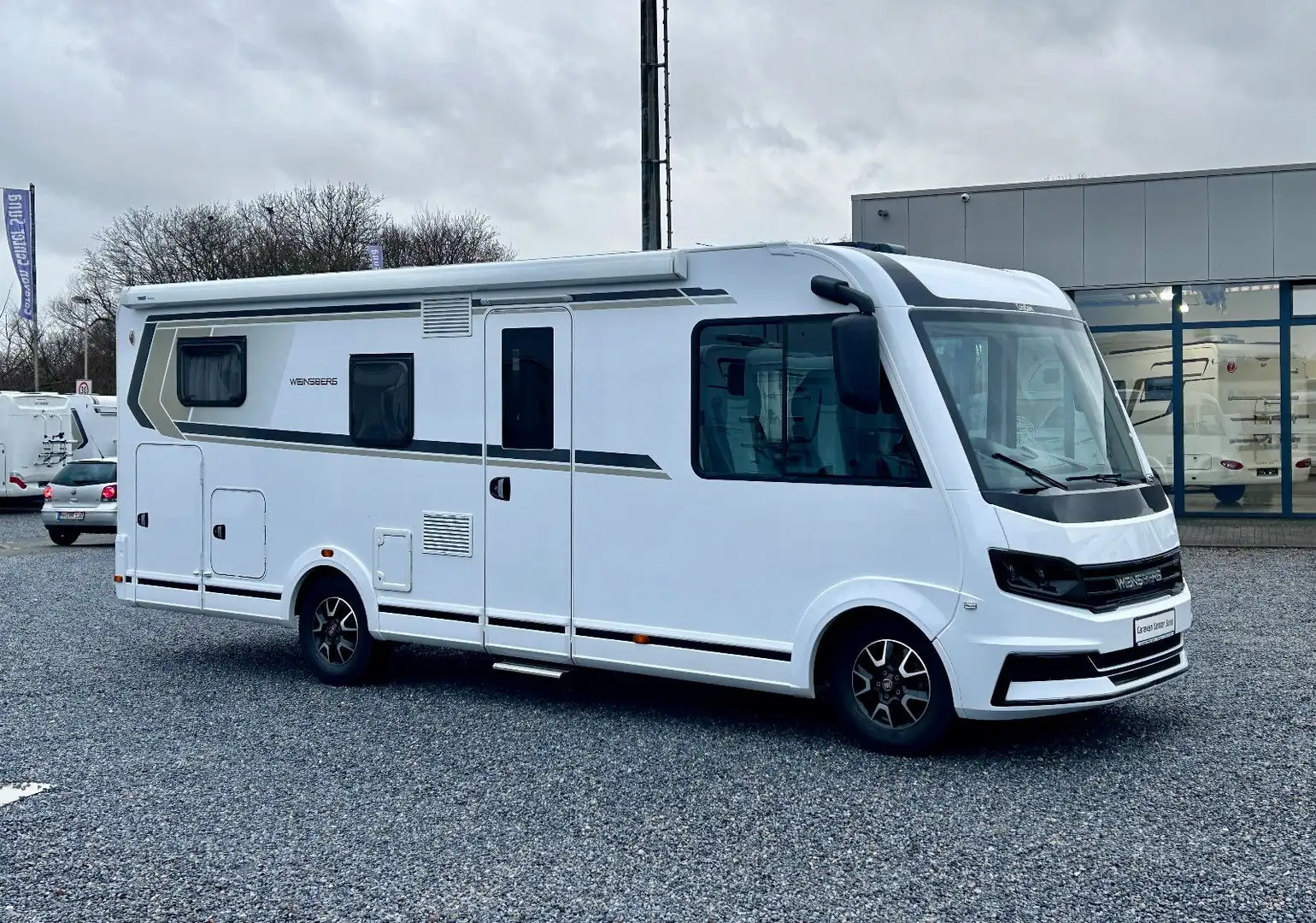Weinsberg CaraCore 700 MEG *Einzelbetten-Hubbett-Sat.TV* Bianco - 1