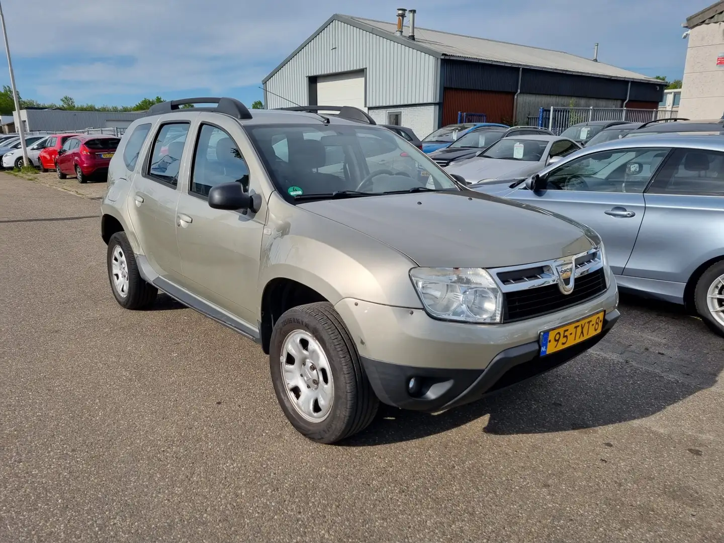 Dacia Duster 1.6 Lauréate LPG -G3 2wd Airco! Bj:2012 NAP! Grijs - 2