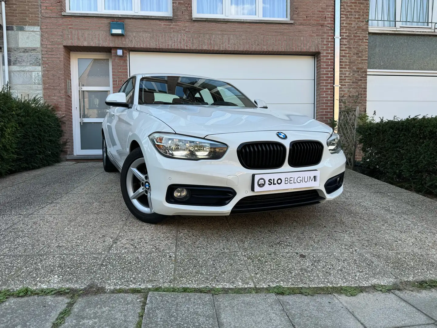 BMW 118 Garantie - 99.990km - Cruise Control - Euro 6 bijela - 1