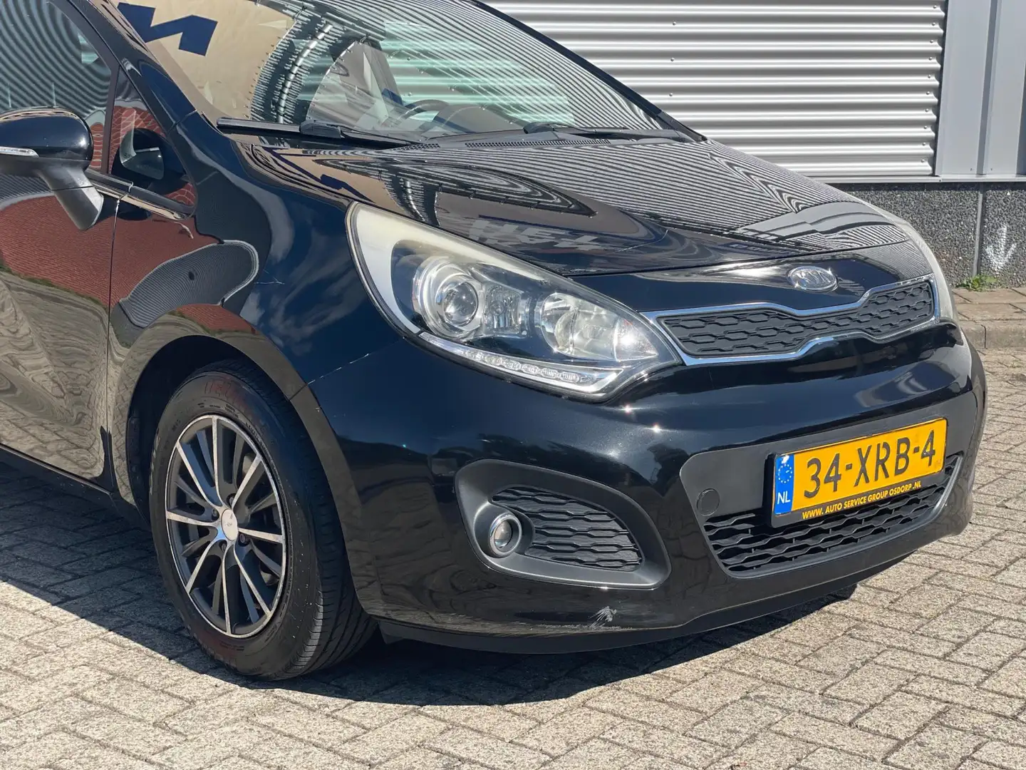 Kia Rio 1.2 CVVT Super Pack JAAR APK | KEYLESS | NAVI Zwart - 2