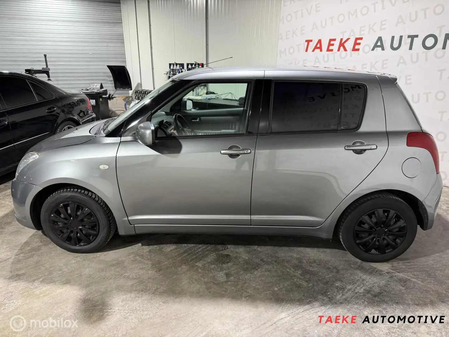 Suzuki Swift 1.3 GA Apk/Airco/Stoelverwarming/Lees tekst Grijs - 2