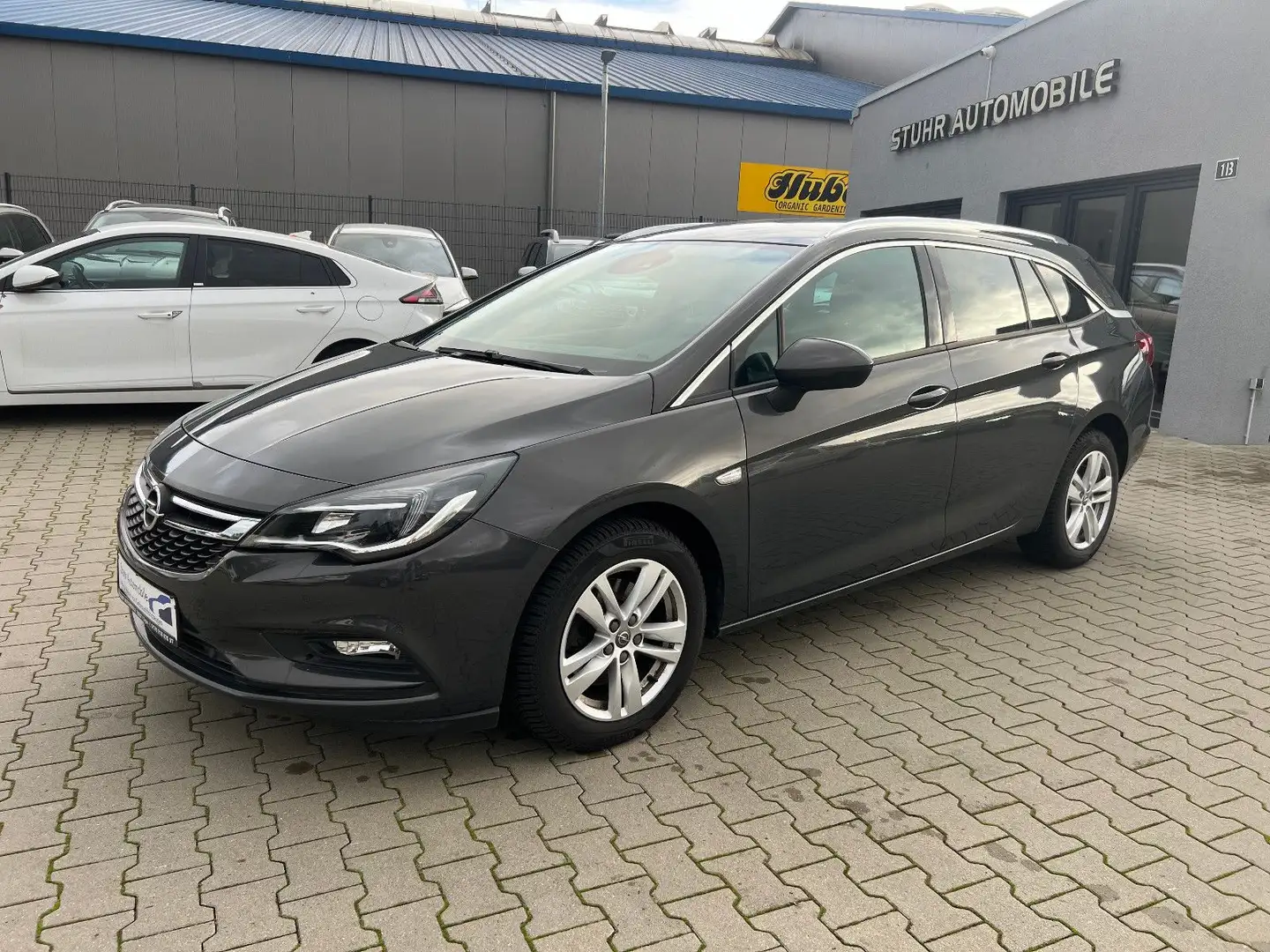 Opel Astra K Sports Tourer 1.6 Aut. Navi PDC Kame SHZ Grau - 1