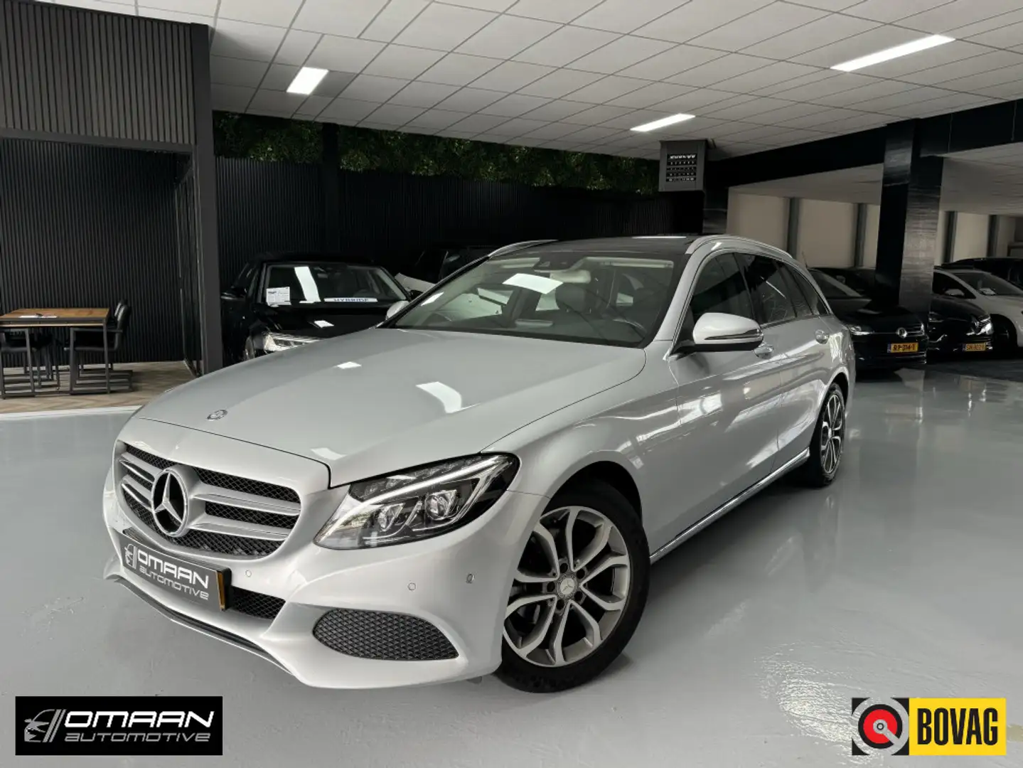 Mercedes-Benz C 180 Estate AUT. PANO TREKHAAK LED AMG Grijs - 1