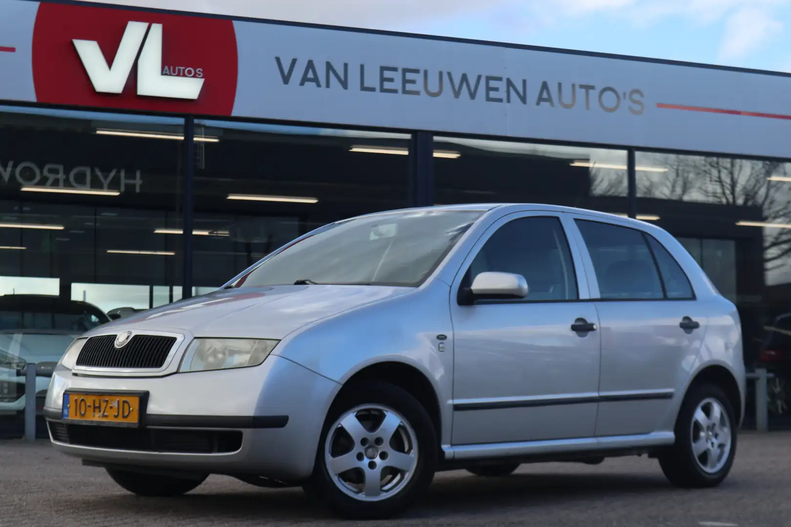 Skoda Fabia 1.4 Comfort | Trekhaak | Cruise | Nieuwe APK Grijs - 1
