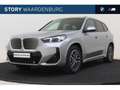 BMW iX1 eDrive20 M Sport / Panoramadak / Sportstoelen / St Grijs - thumbnail 1