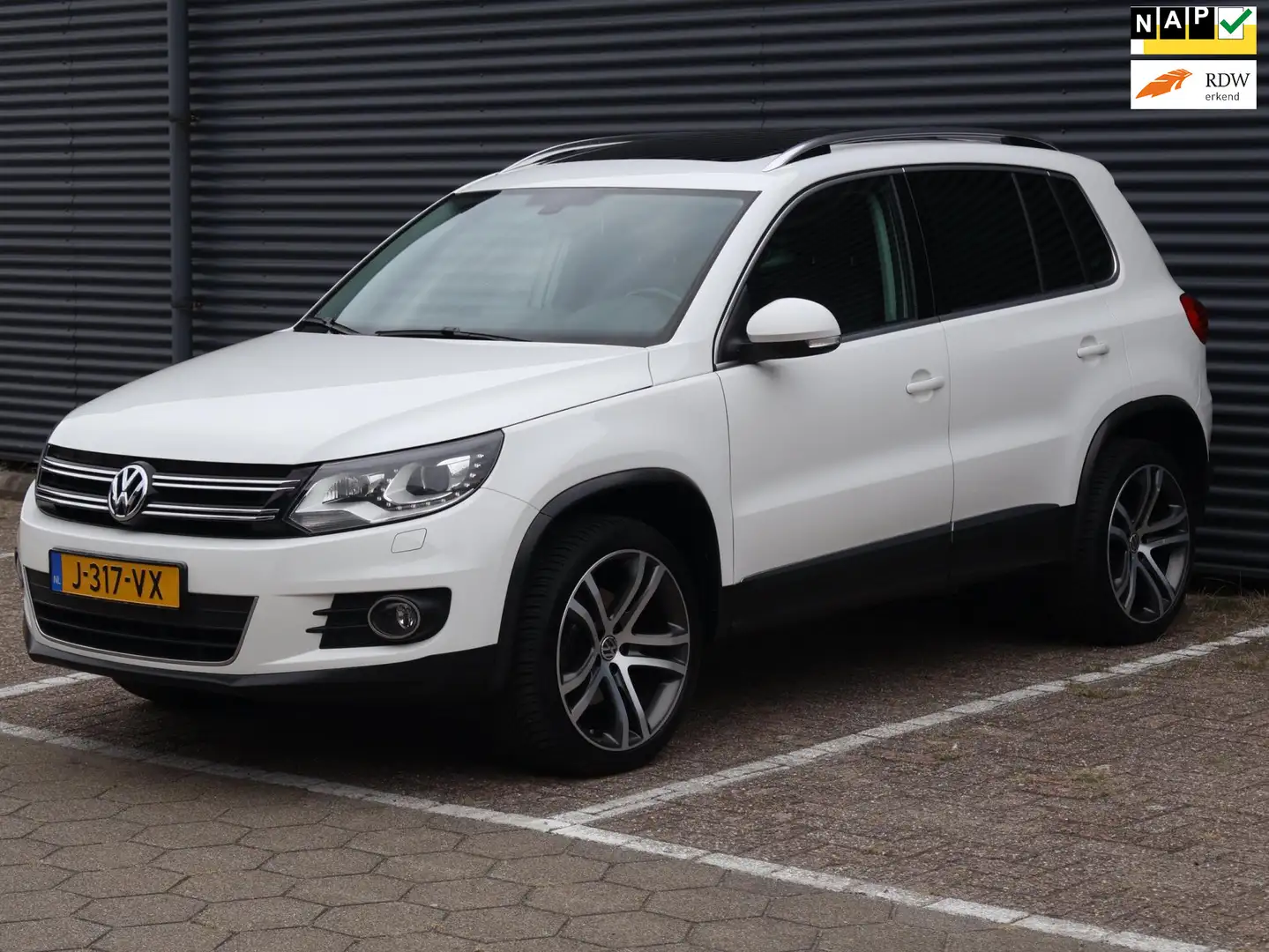 Volkswagen Tiguan 2.0 TSI Sport&Style 4Motion|Pano|Cam|Nav|Automaat| Blanc - 1
