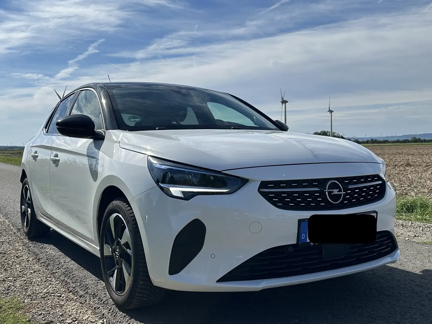 Opel Corsa-e Elegance*11 kW OBC*2 J. Garantie*Batterie-Zert.*Allwetter*Navi*Sitz-u.Lenkrad Hzg.*Park & Go*TÜV Neu Weiß - 1