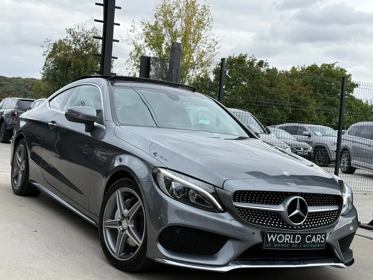 Mercedes-Benz C 180 i Coupe PACK AMG - TOIT PANO - NAVI - CAM - FULL Grijs - 2