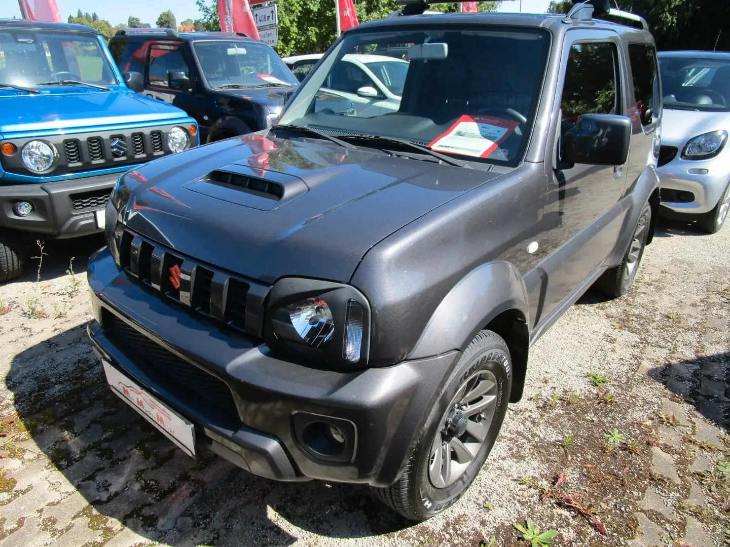 Suzuki Jimny 1.3 ALLGRIP Style+Winterräder +AZV Gris - 1