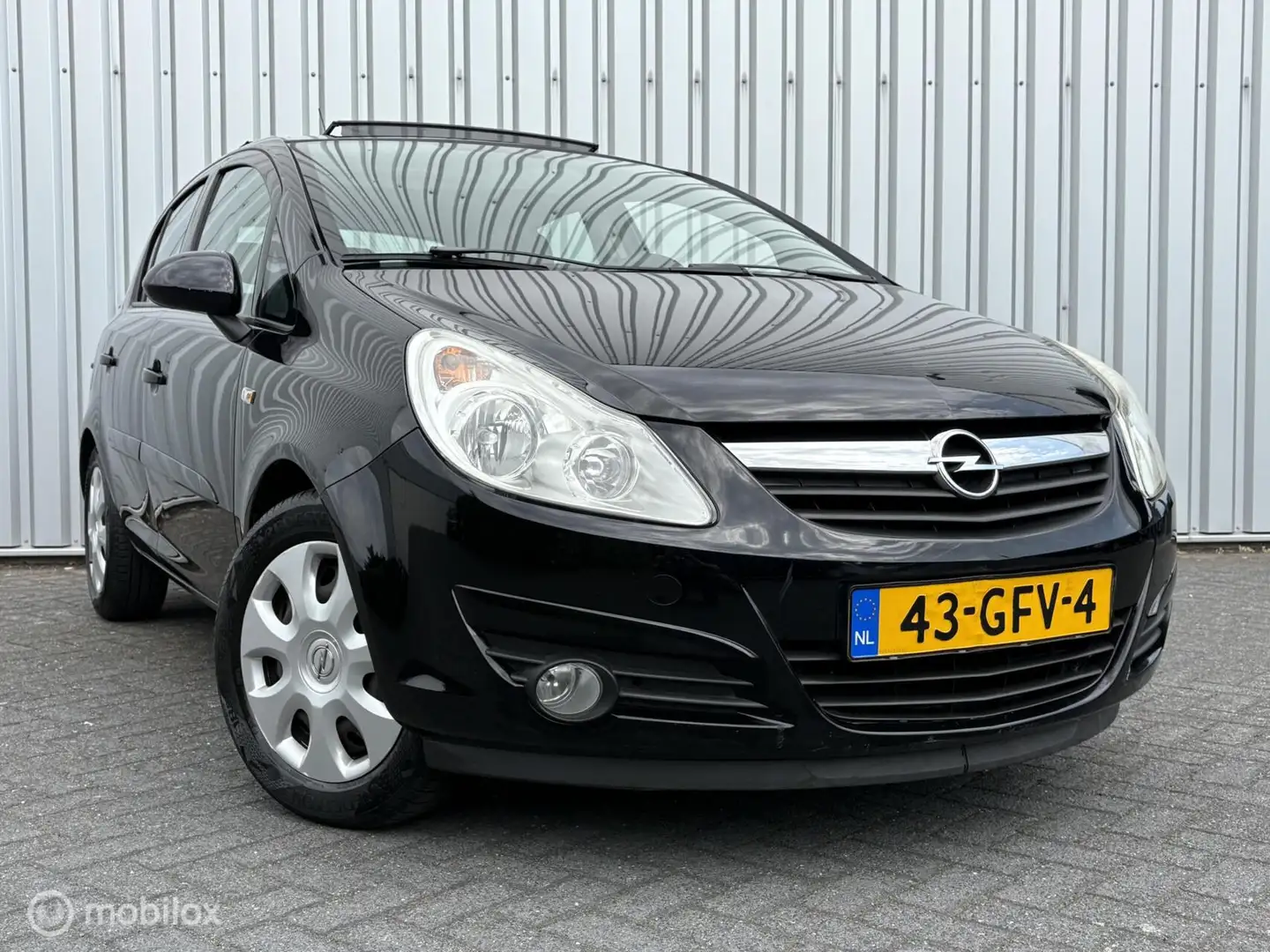 Opel Corsa 1.4-16V Business | Airco | Pano | Cruise | 5 drs | Schwarz - 1