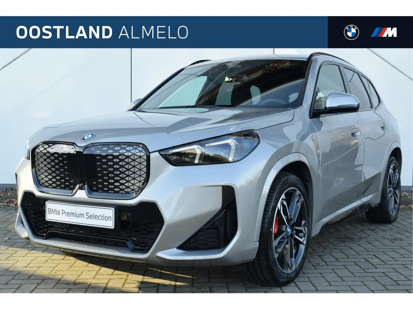 BMW iX1 eDrive20 M Sport / Panoramadak / Trekhaak / M Adap Grijs - 1