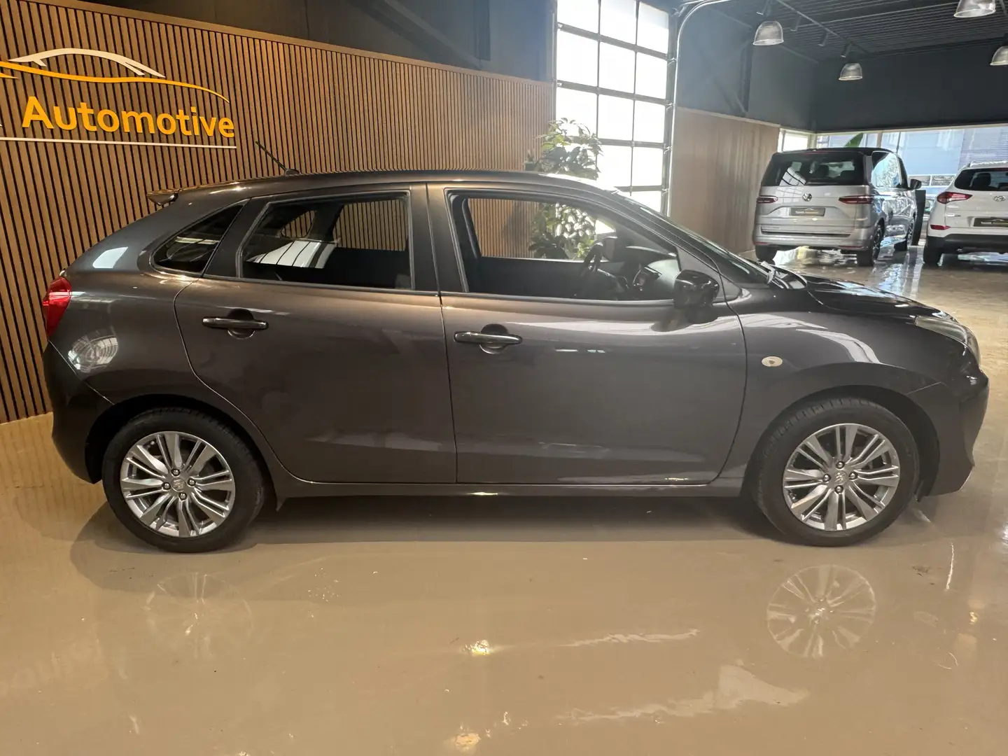 Suzuki Baleno 1.2 Exclusive LMV Airco Gris - 2
