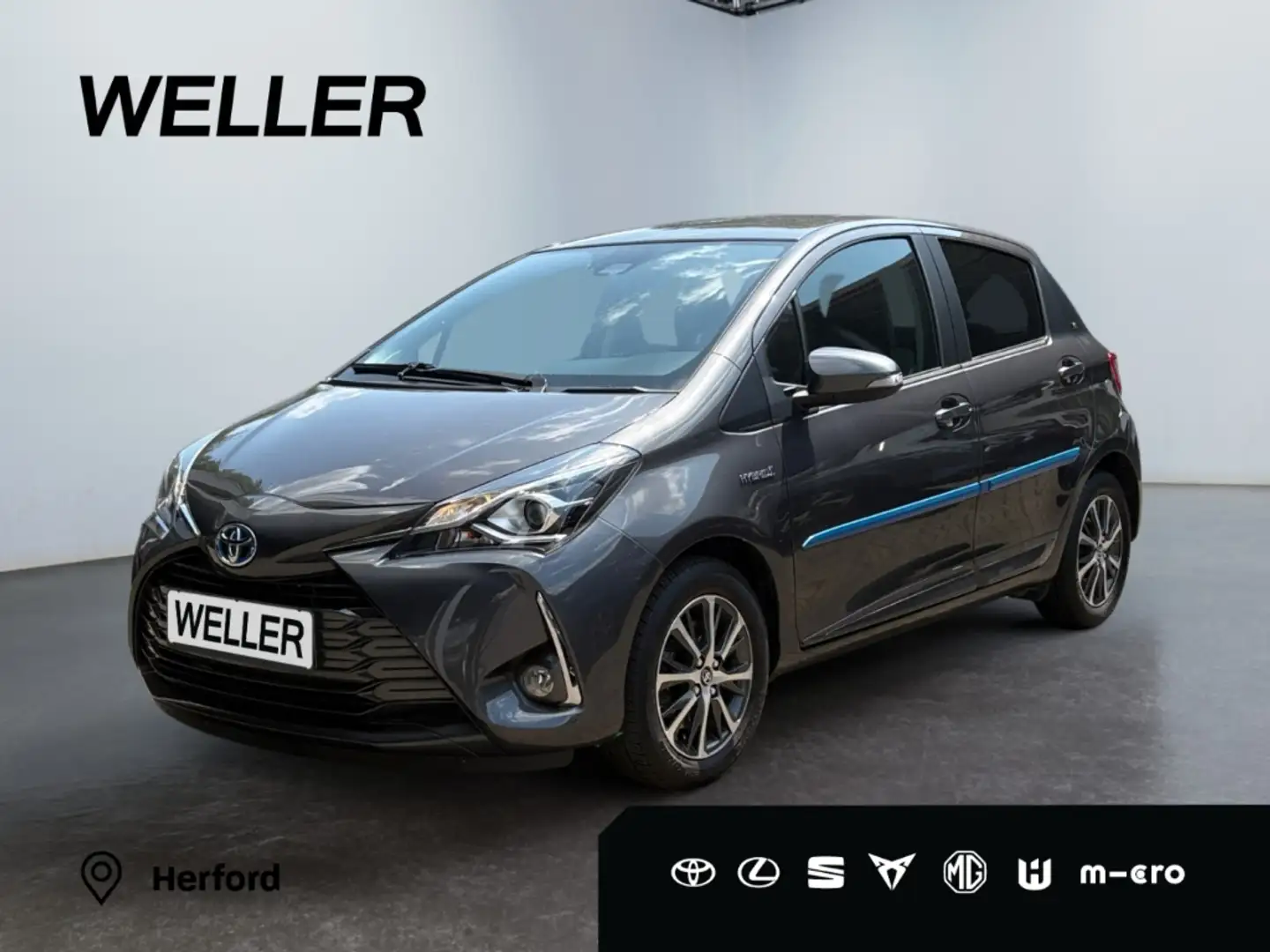 Toyota Yaris Hybrid 1.5 Y20 Team D *Kamera*SHZ*Spurhalte* Grijs - 1