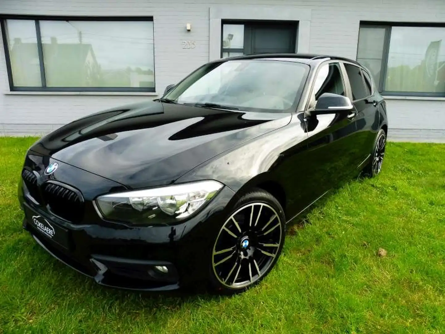 BMW 116 i Navi/AutAirco/ParkAssist/Cruise/Bluetooth/18"M Zwart - 1