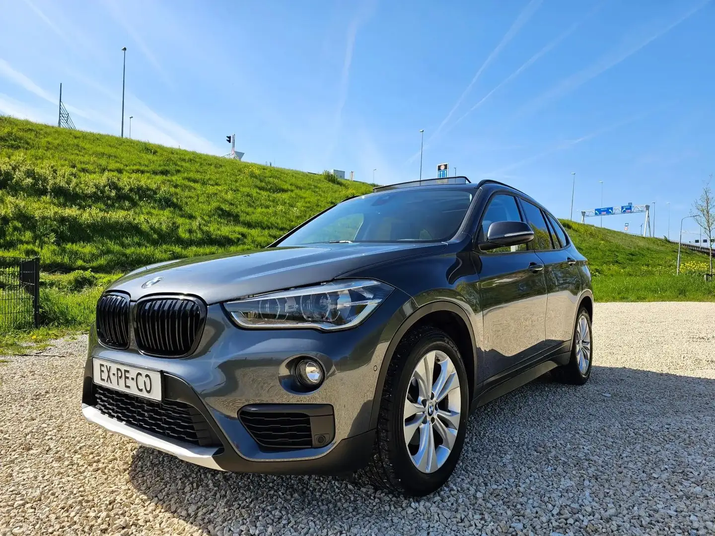 BMW X1 SDrive18i 2019 PANORAMADAK/ CAMERA Grijs - 1