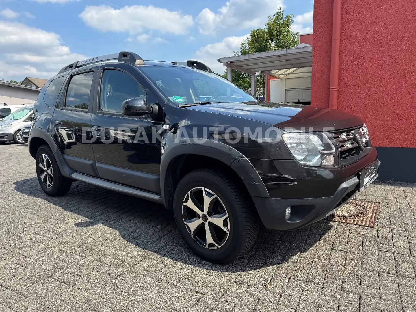 Dacia Duster I Laureate 4x2 / PDC / AHK / SITZHEI. Schwarz - 1