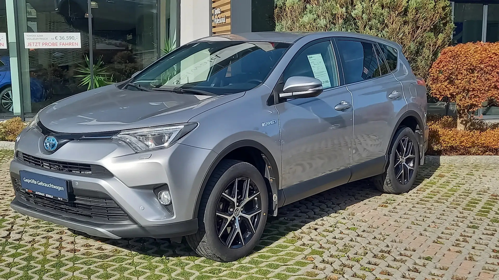 Toyota RAV 4 RAV4 2,5 Hybrid Lounge 4WD Aut. Silber - 1
